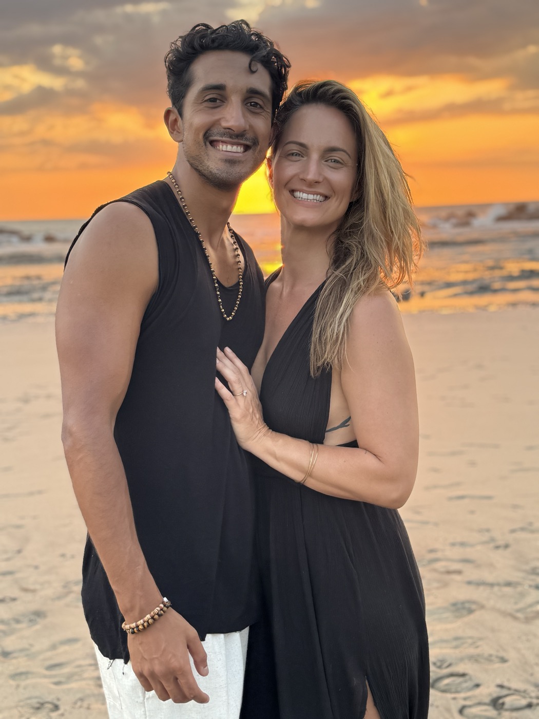 Raj and Natalie at sunset on the beach